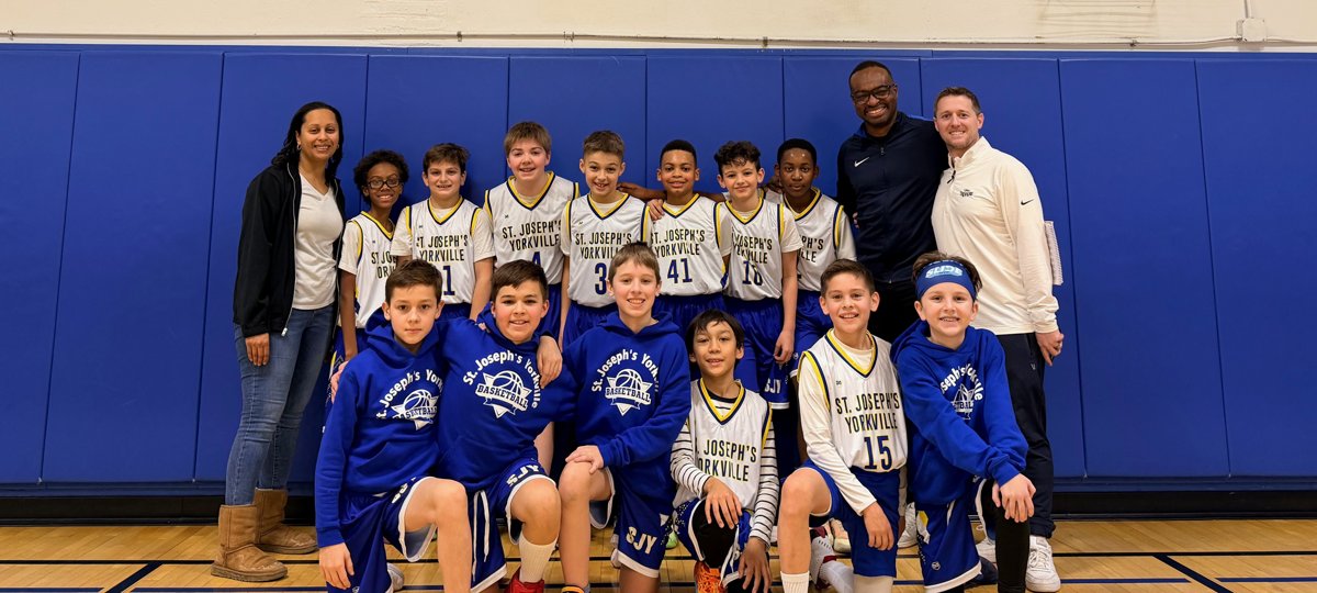 A St. Joseph's Yorkville boys basketball team with their coaches.